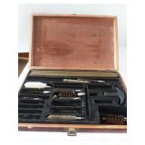 Gun cleaning kit in wooden box