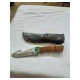 Fixed blade knife with leather sheath