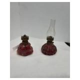 Pair of red glass oil lamps