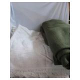 White Beadspread and green blanket