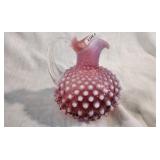 Small Fenton Cranberry pitcher with a touch of