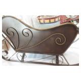 A Christmas sled filled with Christmas items