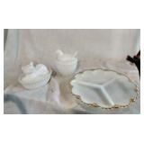 White dish,  dove and cat