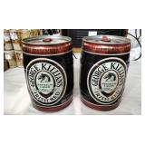 Two George Killians Irish Red cans