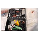 Assortment of tools and jumper cables.