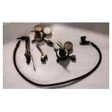 Gas gauge. And cutting torch.