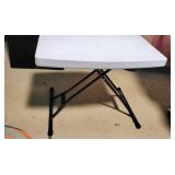 Two white folding tables