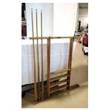3 pool sticks & Pool storage rack.