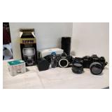 Assortment of Vintage cameras and accessories.