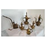 Antique brass coffee pots and a water pipe