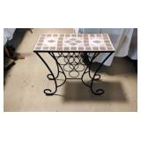 Metal wine table with stone top.