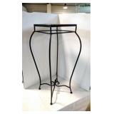 Metal table with stone top.