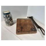 Paper cutter and jar of buttons
