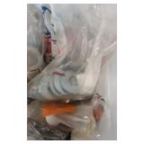 Small plastic container full of odds and ends