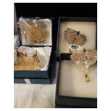 Four goldtoned pendants