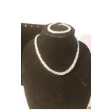 Silver colored necklace and sterling bracelet