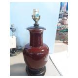 Ceramic Vase style lamp with wood base.