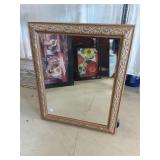 Decorative Wall Mirror with Brasstone Frame.