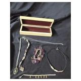 Four bracelets and a necklace.