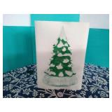 Lighted snow cap revolving tree