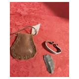 Firestarter and brown leather bag