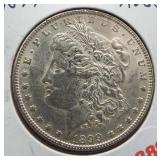 1899 Morgan silver dollar. Choice AU, better