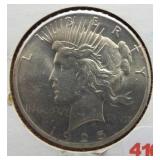 1925 Peace silver dollar.