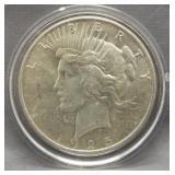 1925 Peace silver dollar.