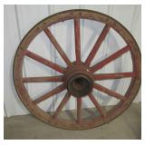 Wood wagon wheel. Measures 41" across.