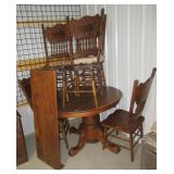 Oak dining table with leaf and (6) Pressed back Oak dining table with leaf and (6) Pressed back