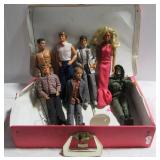 Various Ken and Barbie dolls and Barbie carrying