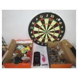 Cork dart board, various toy cars and figures,