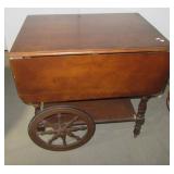 Wood double drop leaf tea cart on castors.