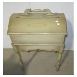 Single drawer sewing cabinet with hinged top. Single drawer sewing cabinet with hinged top.