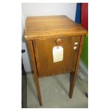 Wood cabinet with hinged drop front. Measures 30"