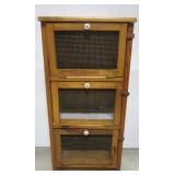 Three section pine cabinet. Measures 35" h x Three section pine cabinet. Measures 35" h x