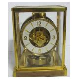 LeCoultre dome clock. Measures 9" h x 7" w x 5" LeCoultre dome clock. Measures 9" h x 7" w x 5"