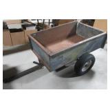 Pull behind garden trailer with dump bed. Note: