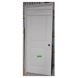 Two panel interior door with jamb. Measures 82" x Two panel interior door with jamb. Measures 82" x