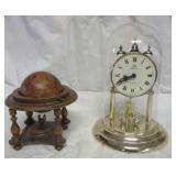 Elgon American dome clock and a small wood globe. Elgon American dome clock and a small wood globe.