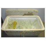 Styrofoam cooler filled with glass canisters and