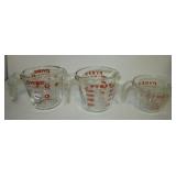 (3) Pyrex glass measuring cups.