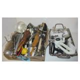 Box filled with kitchen utensils including Box filled with kitchen utensils including