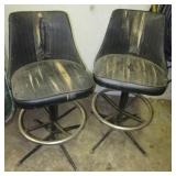 (2) Swivel chairs. Both show wear.