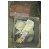 Wood crate filled with various buffing pads,