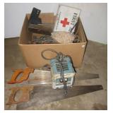 Hand saws, battery charger, first aid box, table Hand saws, battery charger, first aid box, table