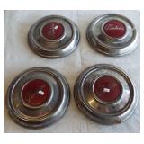 Set of (4) Vintage Pontiac hubcaps.