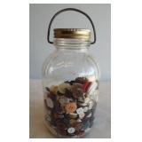 Glass jar with wire bail containing a wide