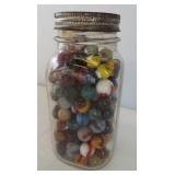 Ball canning jar with glass lid filled with a