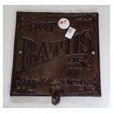 Heavy cast metal Hot Baths sign with towel hook.